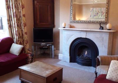 Living Room with Fireplace | Craven House